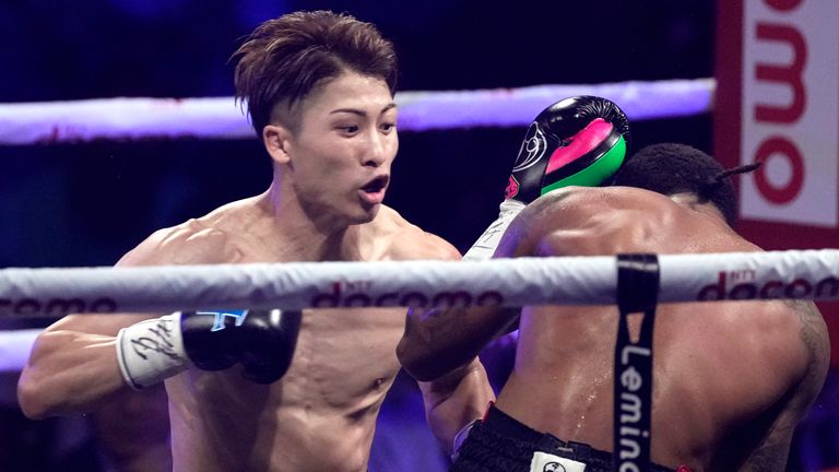 Naoya Inoue, left, of Japan throws a punch against Stephen Fulton of the U.S., during the round four of a boxing match for the unified WBC and WBO super-bantamweight world titles in Tokyo, Tuesday, July 25, 2023. (AP Photo/Hiro Komae)