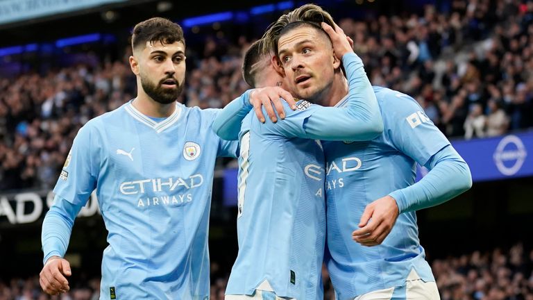 Manchester City's Jack Grealish celebrates with Phil Foden after scoring