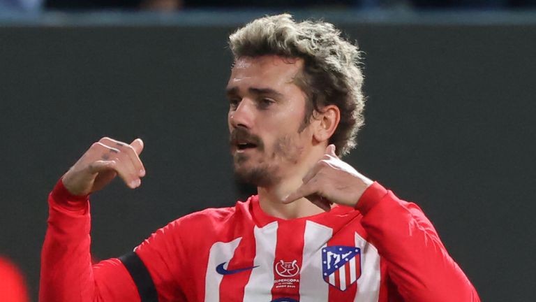 Atletico Madrid's French forward #07 Antoine Griezmann celebrates with Atletico Madrid's Argentinian midfielder #05 Rodrigo De Paul after scoring his team's second goal during the Spanish Super Cup semi-final football match between Real Madrid and Atletico Madrid at the Al-Awwal Park Stadium in Riyadh, on January 10, 2024. (Photo by Fayez NURELDINE / AFP)