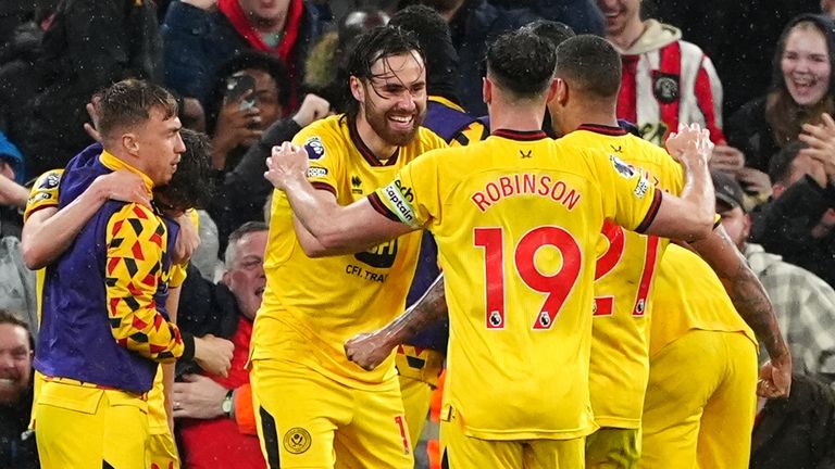 Sheffield United players celebrate after equalising at Liverpool