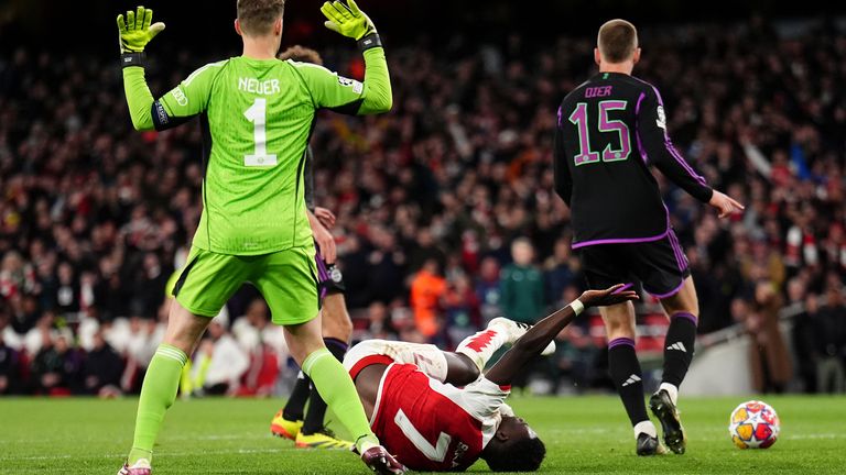 Arsenal's Bukayo Saka goes down under the challenge from Bayern Munich goalkeeper Manuel Neuer during the UEFA Champions League quarter-final, first leg match at the Emirates Stadium, London. Picture date: Tuesday April 9, 2024.