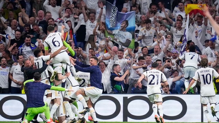 Real Madrid players celebrate after their teammate Joselu scores his side's second goal