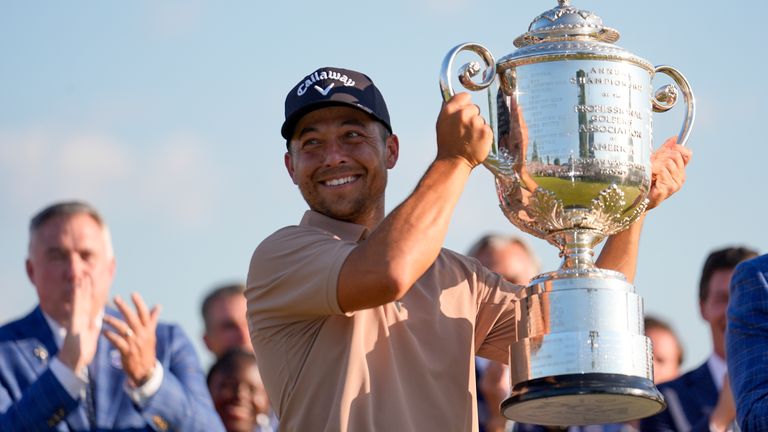 Xander Schauffele holds the Wanamaker trophy after winning the PGA Championship