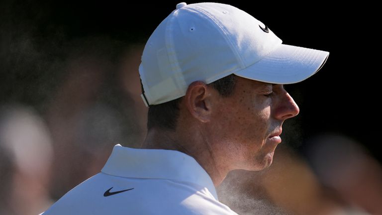 Rory McIlroy, of Northern Ireland, applies sunscreen on the 14th hole during the second round of the U.S. Open golf tournament Friday, June 14, 2024, in Pinehurst, N.C. (AP Photo/George Walker IV)