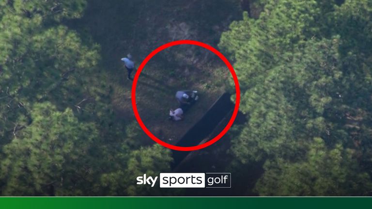 Bryson DeChambeau receives physio treatment in the woods as he battles for the lead on day three of the US Open.